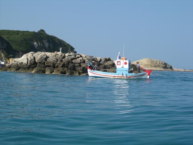 A fishing boat on the sea off the coast of Corfu.